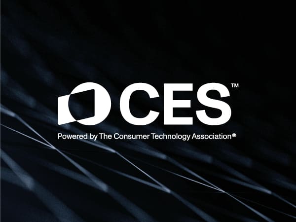 Dark textured background with white CES logo
