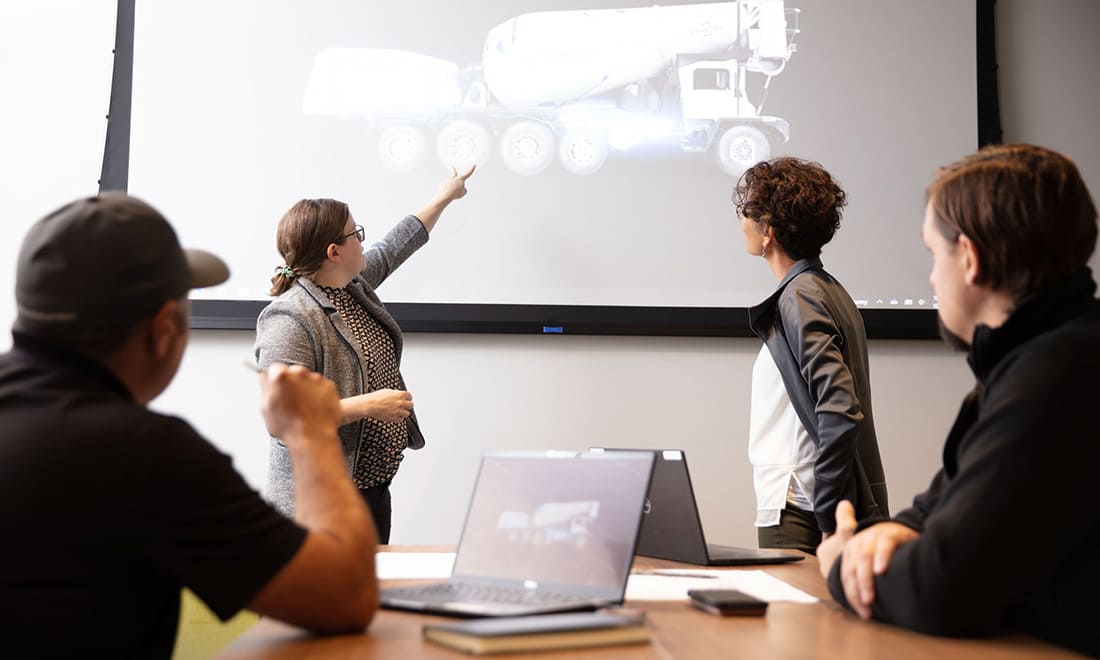 Oshkosh engineers collaborating in a product meeting