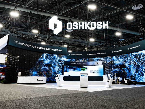 Wide shot of the Oshkosh Corporation booth at CES, highlighting the 