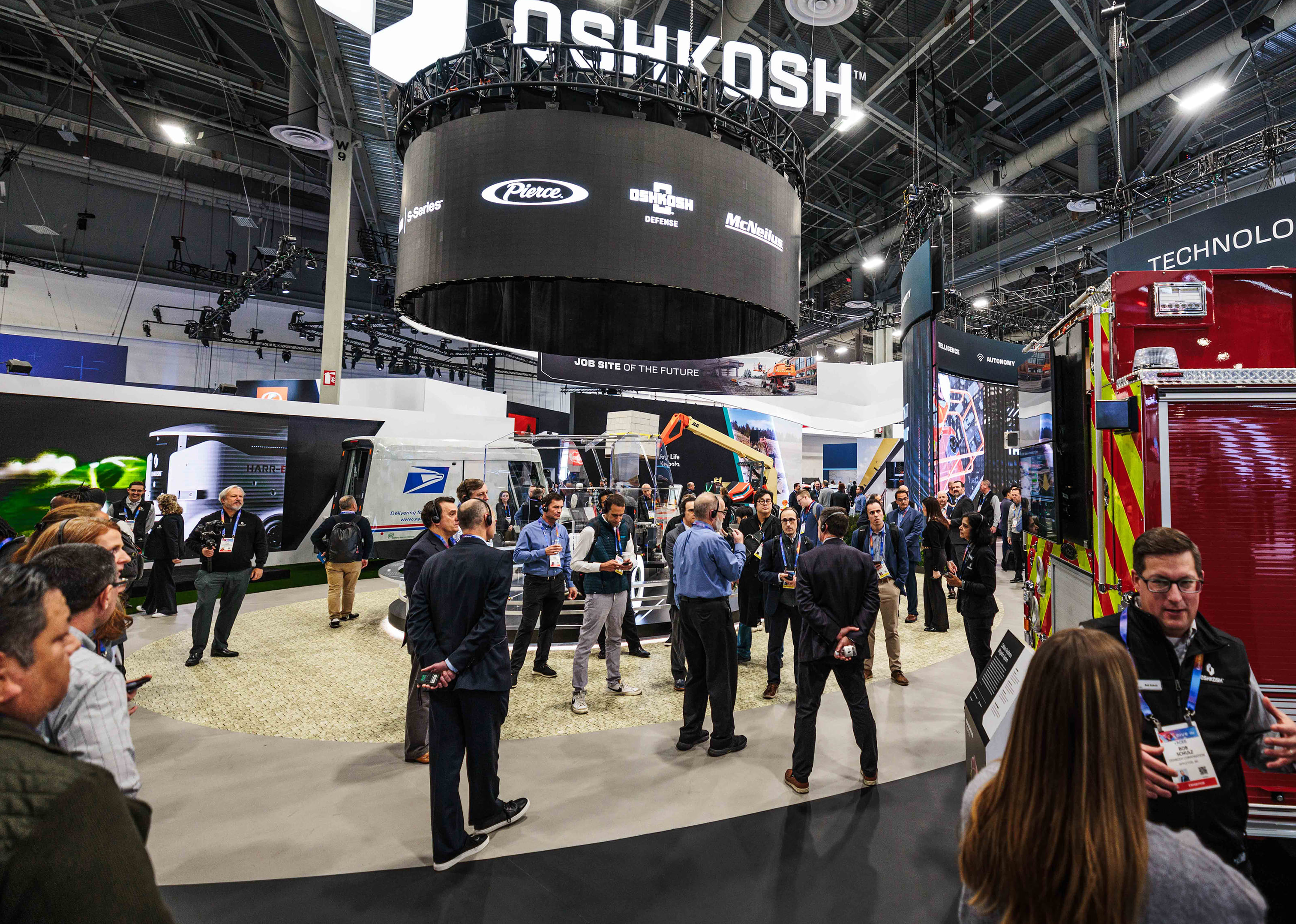 Wide shot of the Oshkosh Corporation booth at CES, highlighting the 