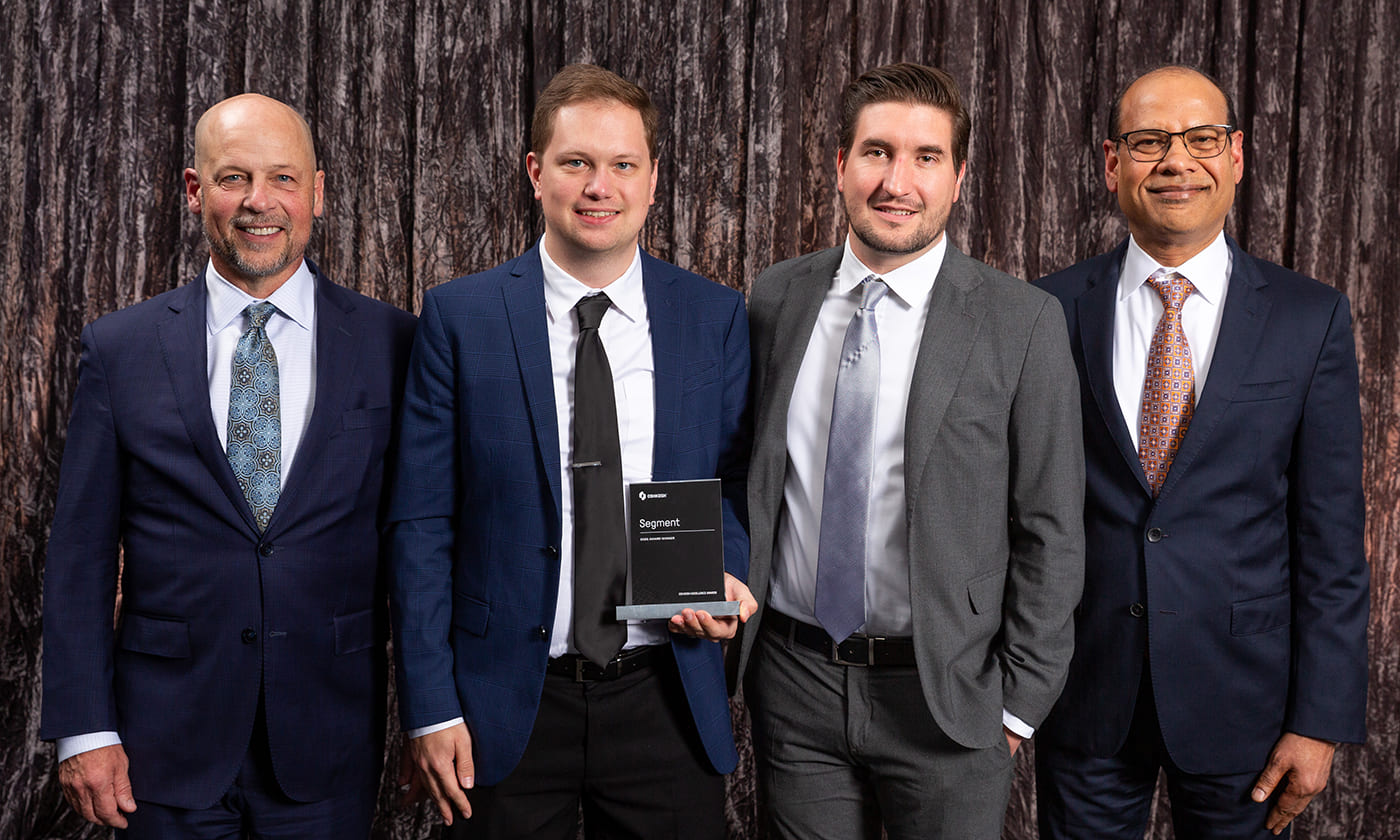 Oshkosh Corporation CEO, John Pfeifer, alongside Anu Khare and Oshkosh team members at the 2025 Oshkosh Excellence Awards