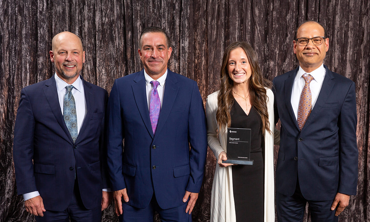 Oshkosh Corporation CEO, John Pfeifer, alongside Anu Khare and Oshkosh team members at the 2025 Oshkosh Excellence Awards