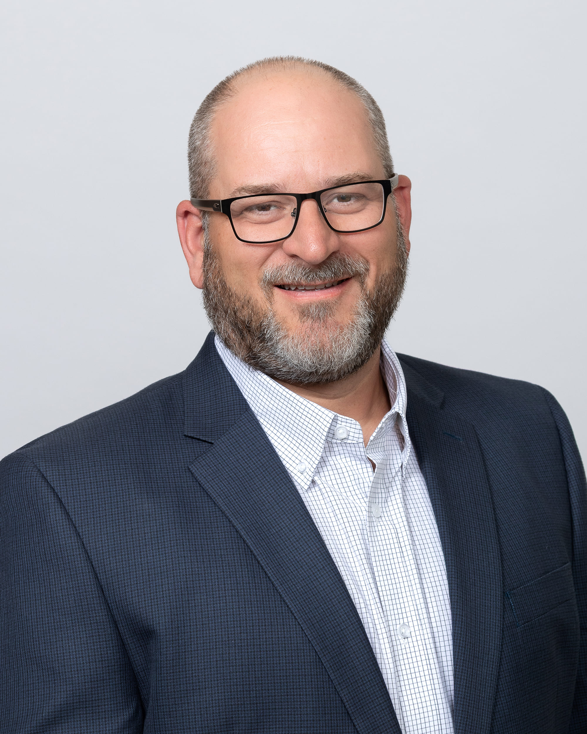 Professional headshot of Brian Green, an Oshkosh Corporation technical fellow