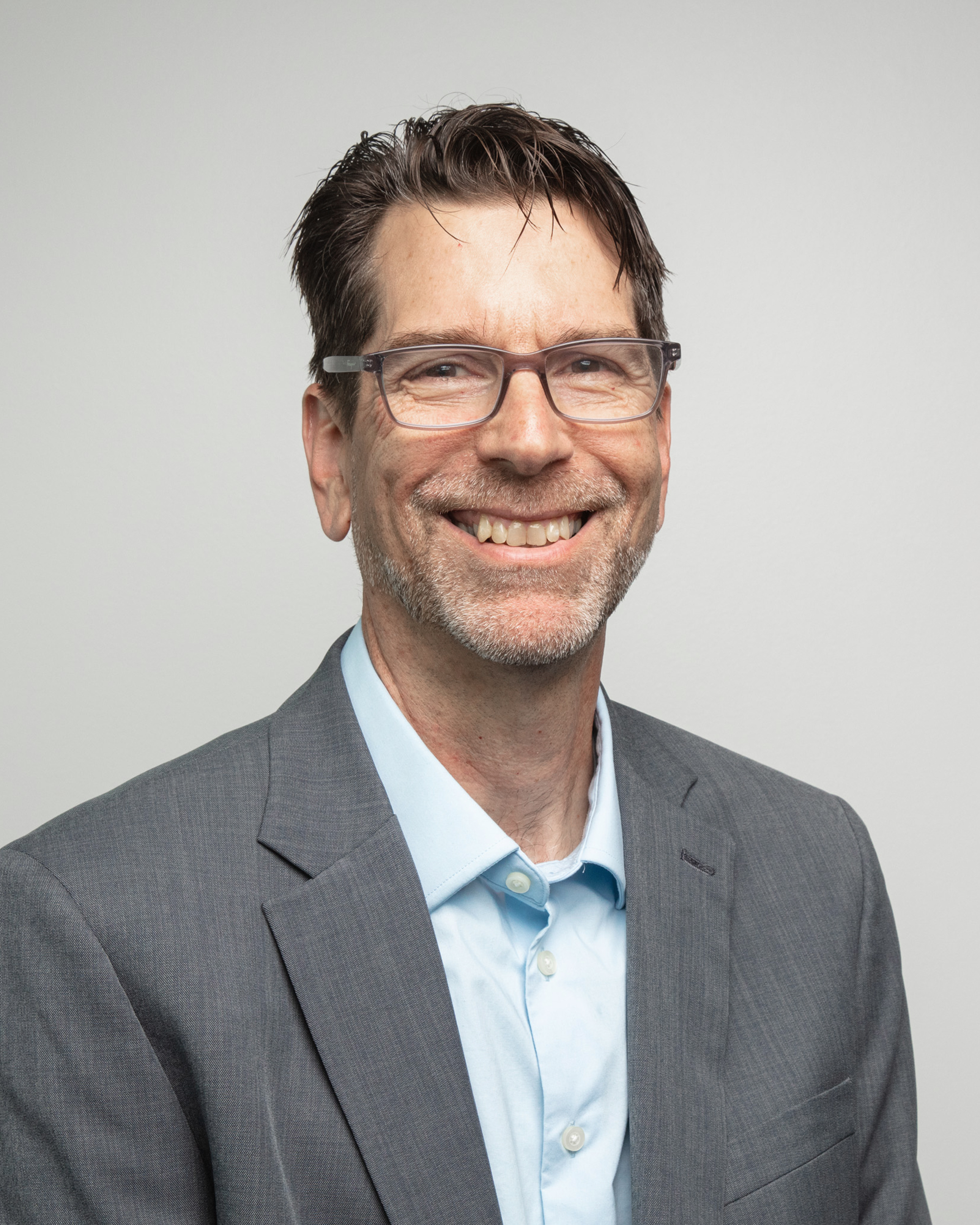 Professional headshot of Jesse Gander, an Oshkosh Corporation technical fellow