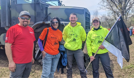 Chief technology and strategic sourcing officer, Jay Iyengar (middle left), with Oshkosh team members who organized Baja SAE Oshkosh