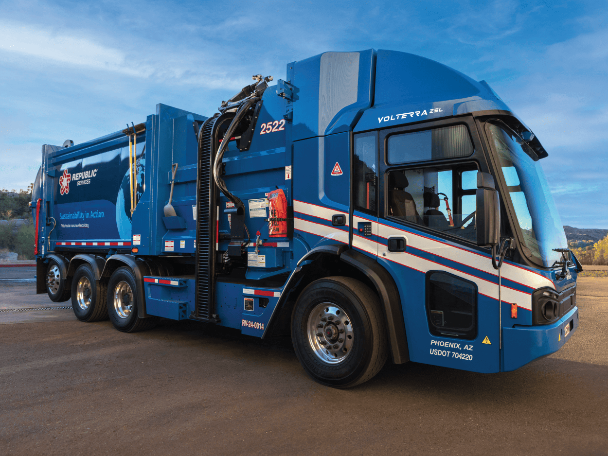 Blue McNeilus Volterra ZSL electric refuse collection vehicle
