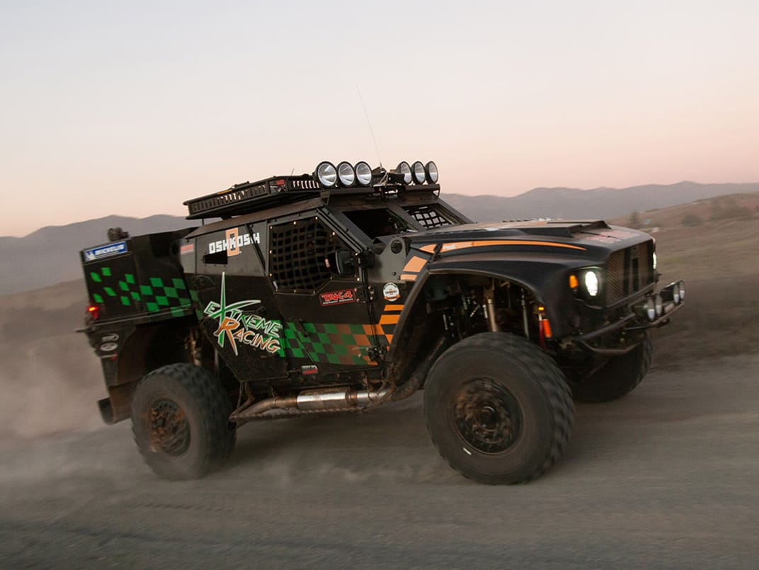 Black Baja 1000 vehicle racing on the track