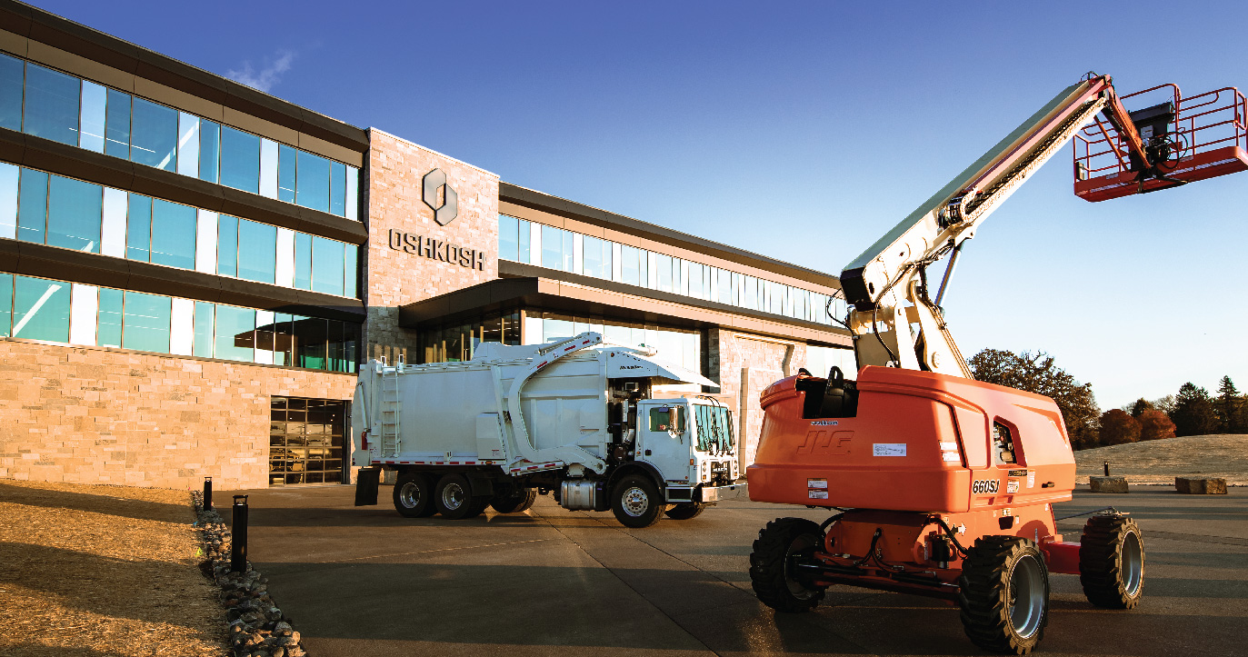 Global Headquarters of Oshkosh Corporation with refuse truck and JLG boom lift