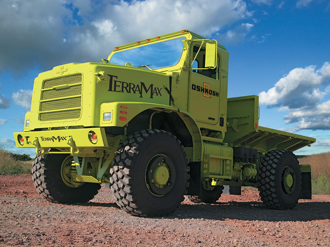 Yellow unmanned, self-driving and self-navigating defense logistics TerraMax vehicle