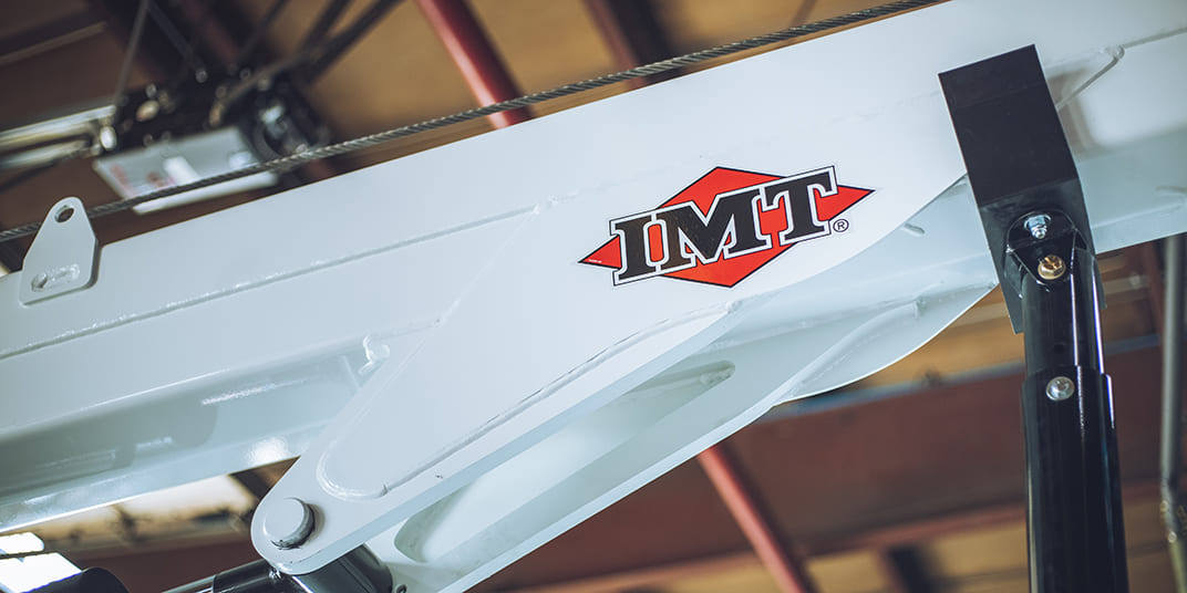 Close up of an IMT arm with the red and black IMT logo