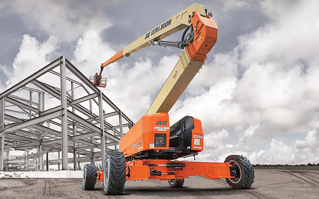 Orange and cream 1500AJP lift operating at a construction site