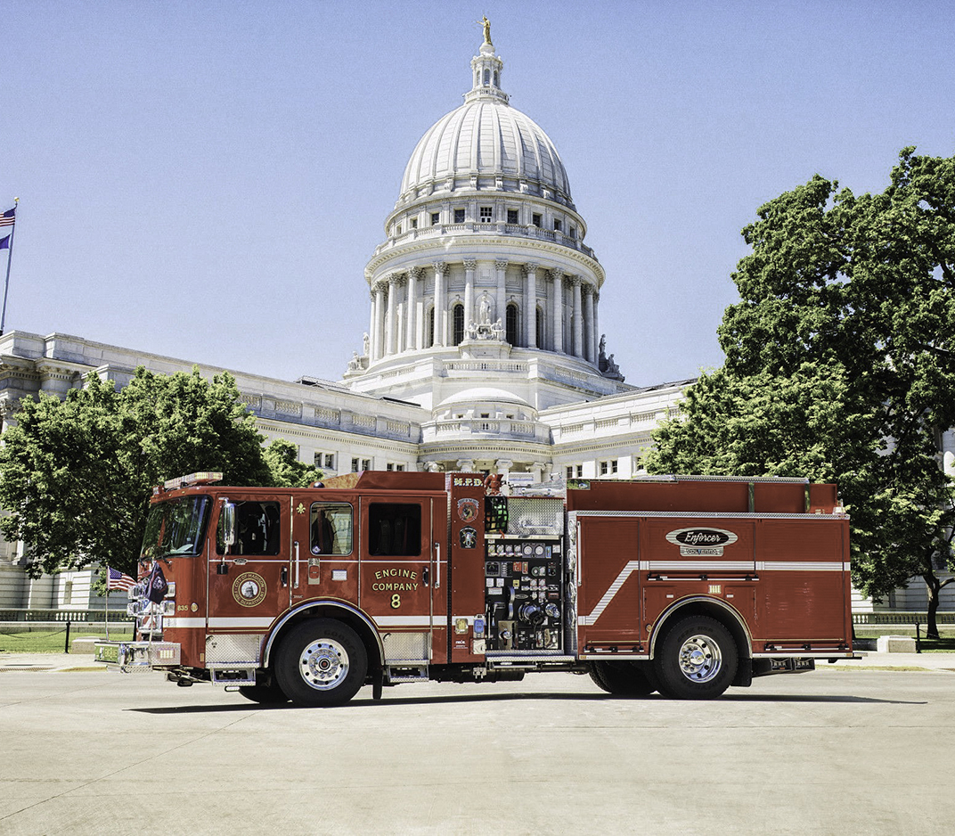 Red Pierce Volterra electric fire truck parked in front of capital building in Madison, Wisconsin
